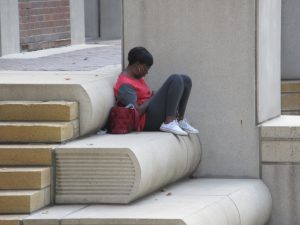 Reader on Kansas City Library Stairs