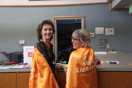 Two librairans with capes and Super Librarian caption
