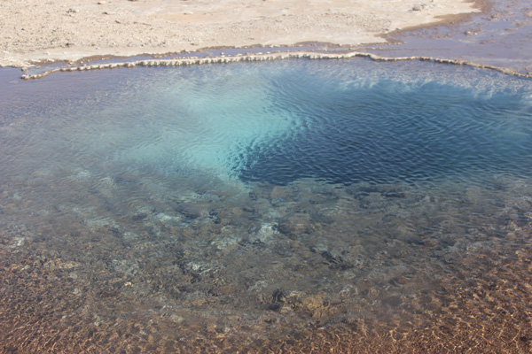 Lapis-colored mineral spring and pool.