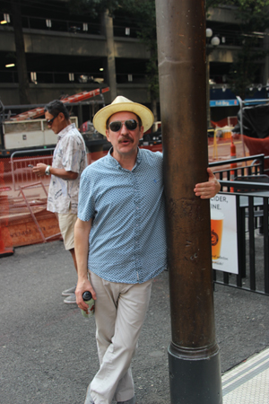Our lively and informative tour guide hugs a copper column attached to a pylon underground.