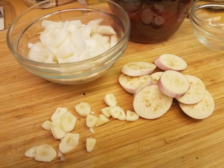 Onions (I chopped them more finely than this but not much), eggplant and sliced garlic.