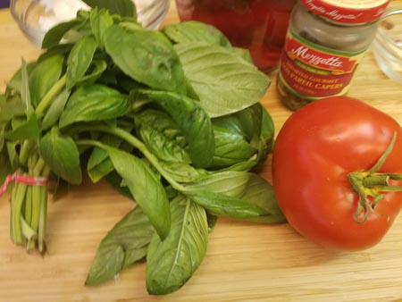Fresh basil, onions, capers and fresh tomato.