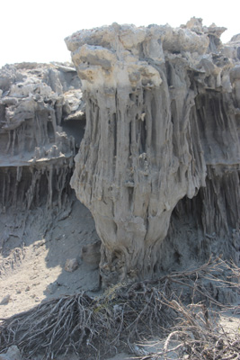 A large "inverted" sand tufa, with a wide top and a narrow bottom.