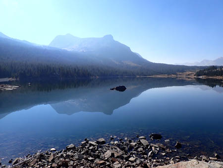 Lake at the top of Tioga pass, mountain reflected, blue, smoky.