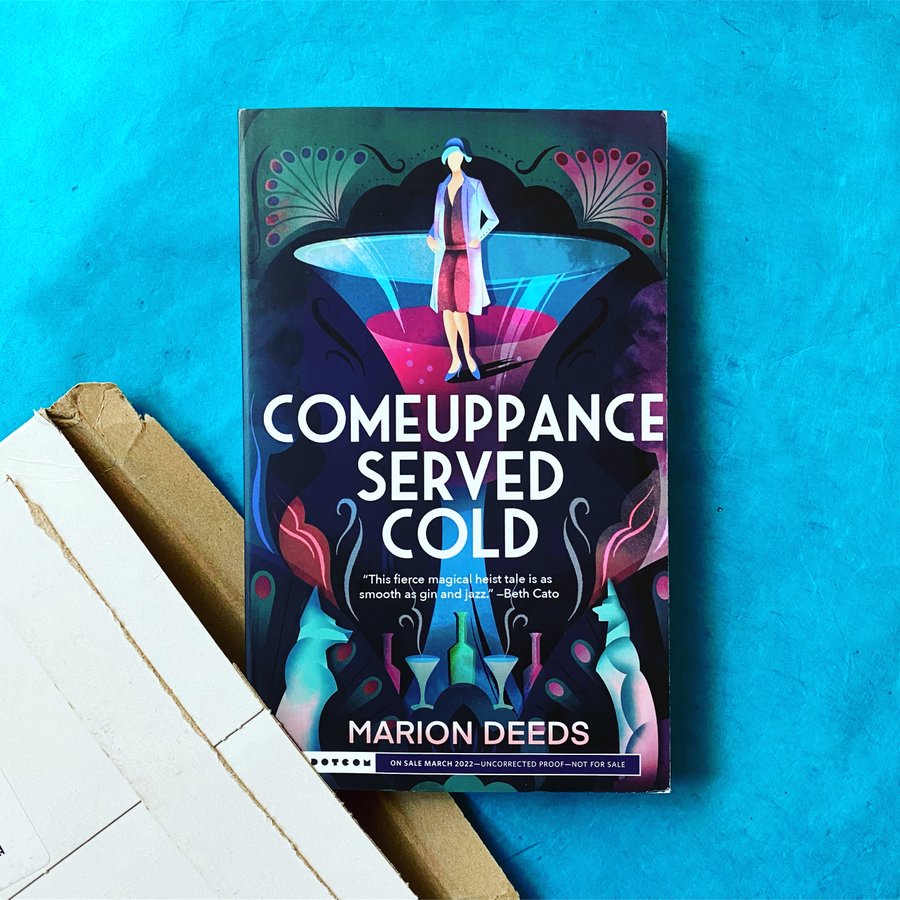 Cover of Comeuppance Served Cold against a matching blue background.