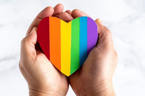 Rainbow heart clasped in two hands.

Image from iStock
